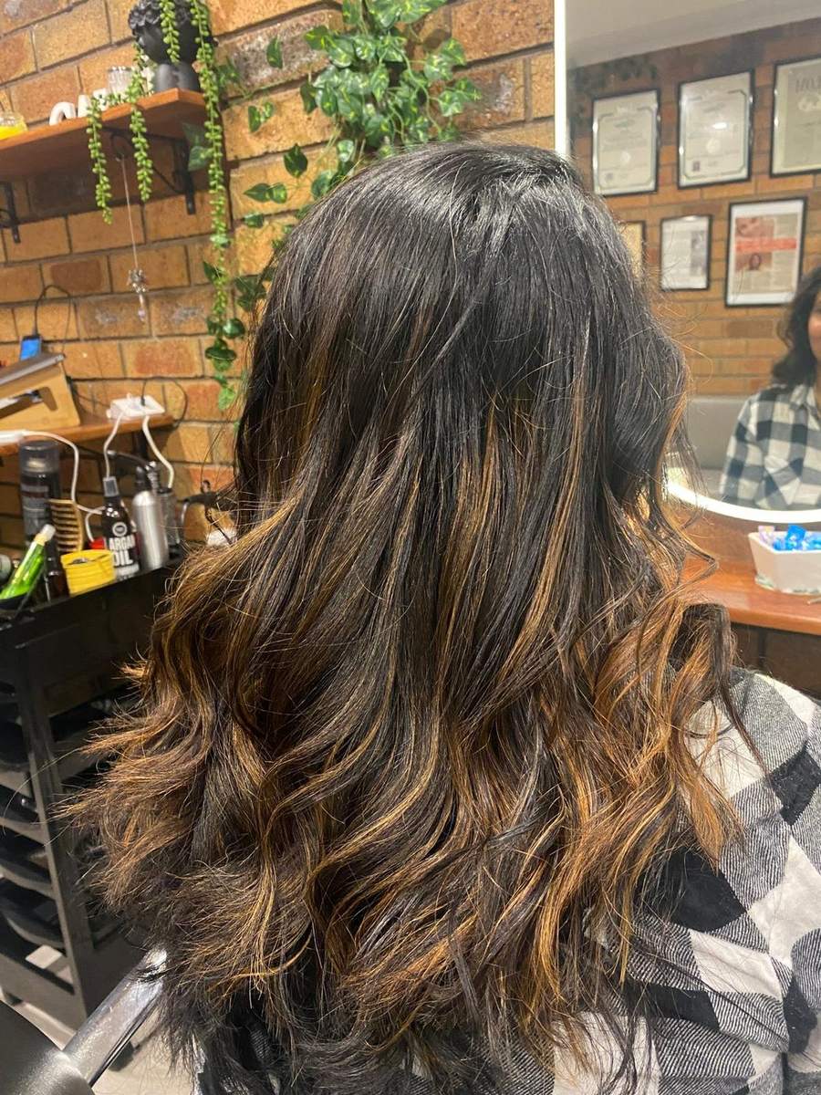 Warm balayage on long dark hair