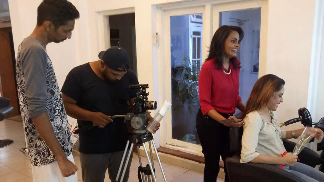 A film crew in the salon during a shoot