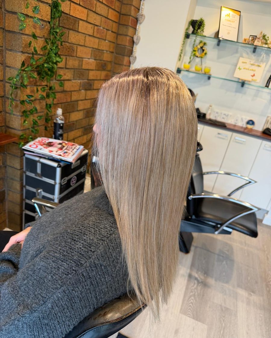 Long blonde hair, smoothed and straight