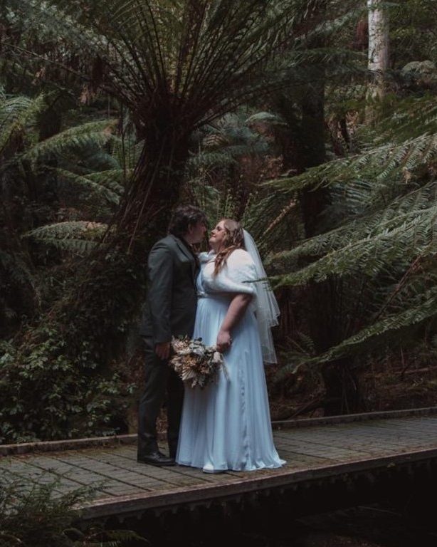 Bride and groom in a fern gully